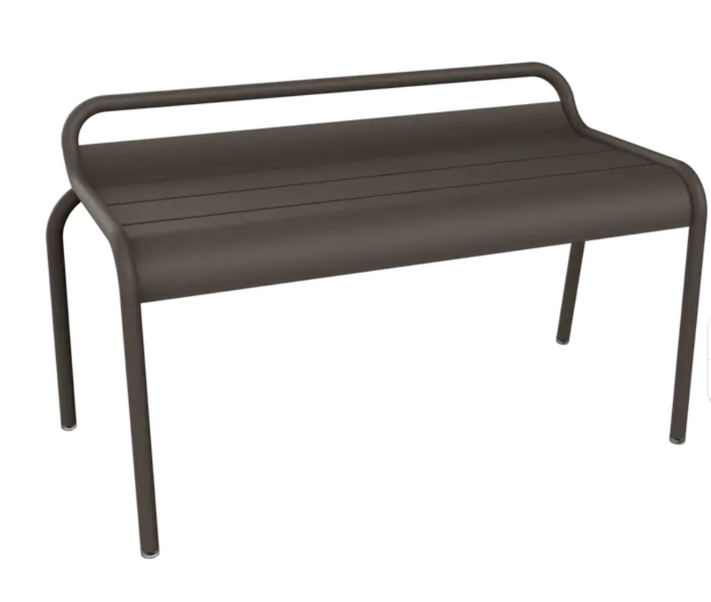 Load image into Gallery viewer, Fermob Luxembourg stackable outdoor bench, 90 cm long, with a metal frame and wood slats, shown in a hall setting.

