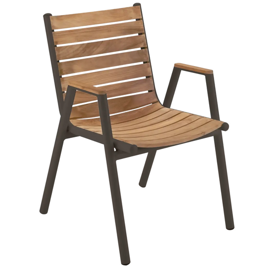 Fermob Pilotis teak armchair with natural wood finish, showcasing a modern outdoor teak Fermob armchair on a patio.
