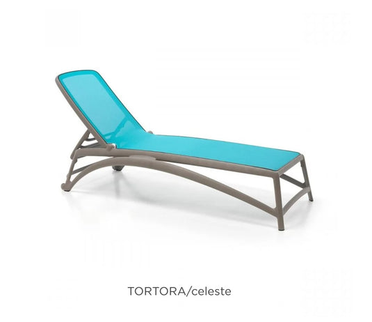 Nardi Atlantico stackable sun lounger with blue cushion, outdoor poolside recliner on patio.