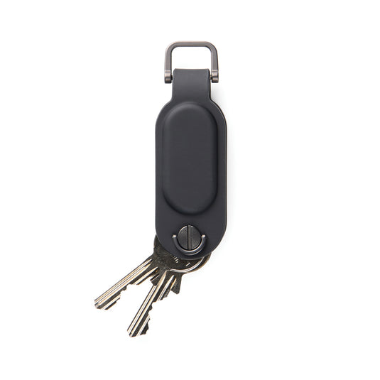 Vinga Baltimore RCS Key Organizer with Finder Dual holding keys and accessories on a table, compact phone and tablet accessory.