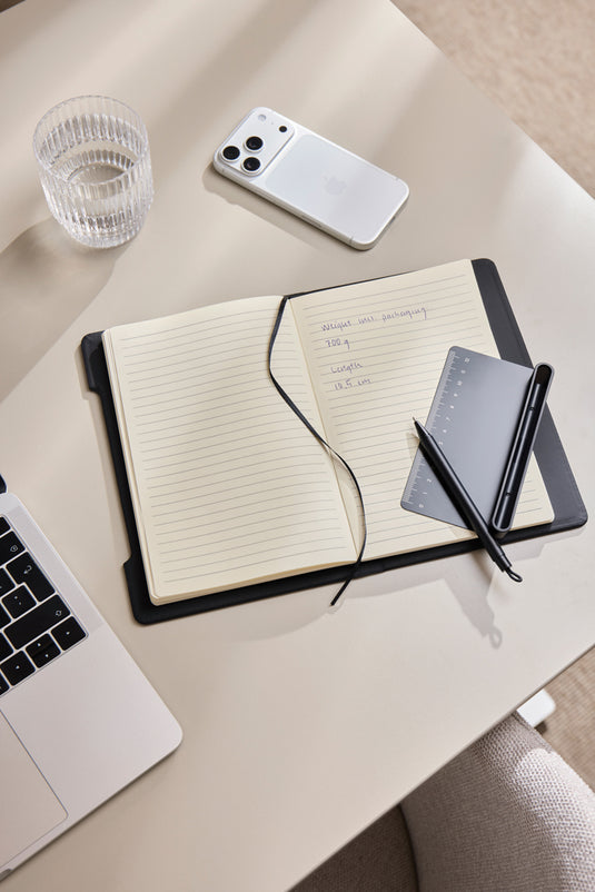 Vinga Baltimore RCS 4-in-1 refillable notebook with black cover and multiple paper sections for writing and note-taking.