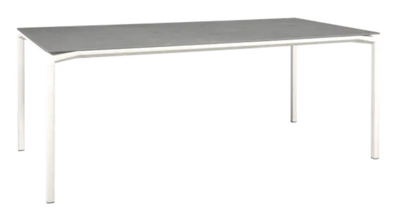 Load image into Gallery viewer, White Fermob CALVI Kreta mineral dining table, 195 x 95 cm, eight seater with sleek tabletop and sturdy legs.
