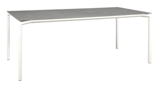 White Fermob CALVI Kreta mineral dining table, 195 x 95 cm, eight seater with sleek tabletop and sturdy legs.