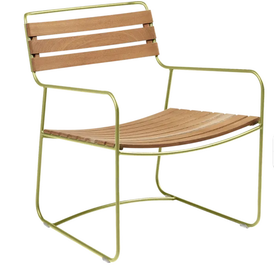 Willow green Fermob metal outdoor armchair with low armrests, designed for stylish outdoor seating and relaxation.