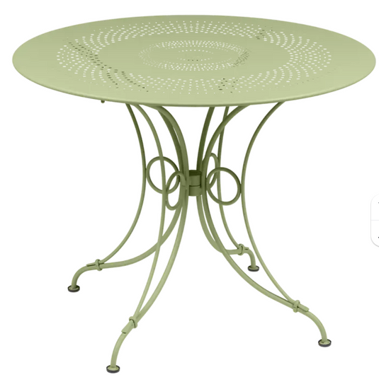 Fermob 1900 outdoor table with 96cm diameter in metal, featuring a sleek round design for garden or patio use.