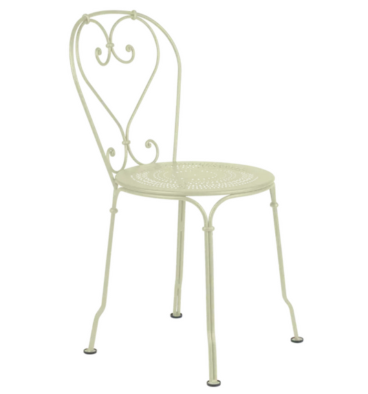 Willow green Fermob 1900 outdoor chair with curved metal frame and slatted seat, ideal for garden or patio seating.
