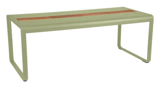 Willow green Fermob Bellevie outdoor dining table with wood and metal construction, 196x90 cm, eight-seater with storage feature