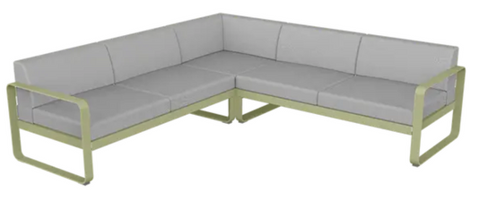 Willow green and grey Fermob Bellevie Composition 2 outdoor sofa set with modular design and plush cushions on a patio.
