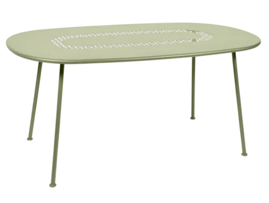 Willow Green Fermob LORETTE oval metal outdoor table, 160 x 90 cm, suitable for dining or outdoor use, shown in a garden setting.