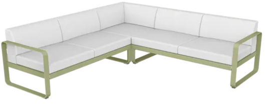 Willow green and off-white Fermob Bellevie outdoor sofa composition with modular lounge pieces on a patio setting.