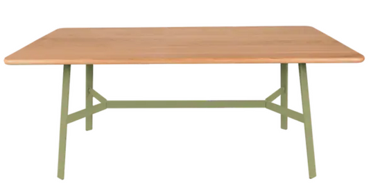 Willow green Fermob SO'O 180x90 cm oak dining table with six seats, showcasing sturdy wooden furniture in a natural setting.