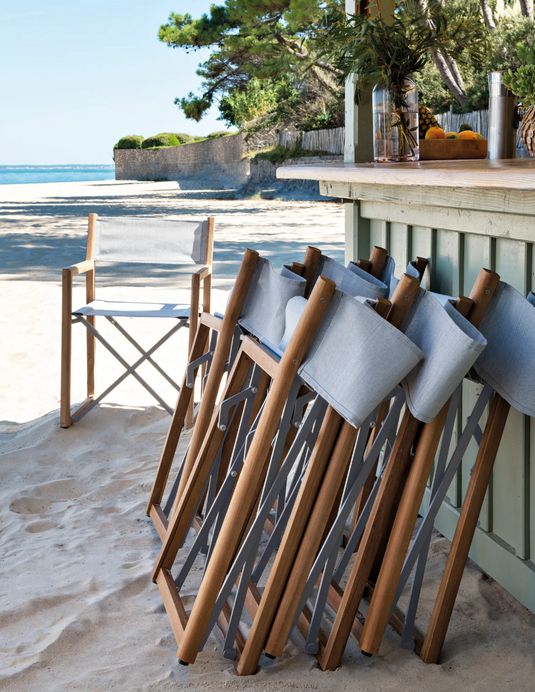 Fermob ZÉNITH teak folding director's chair with armrests, lightweight and foldable for beach or outdoor seating.