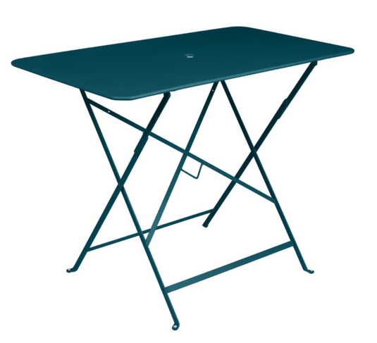 Fermob teal foldable metal bistro table, 97x57 cm, outdoor cafe style with a smooth surface and sturdy design.