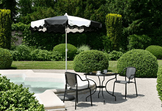 Aluminium parasol with 250cm diameter, wave finish and fringe, by Custom Wood Designs, shown open with fabric canopy and decorative fringe.