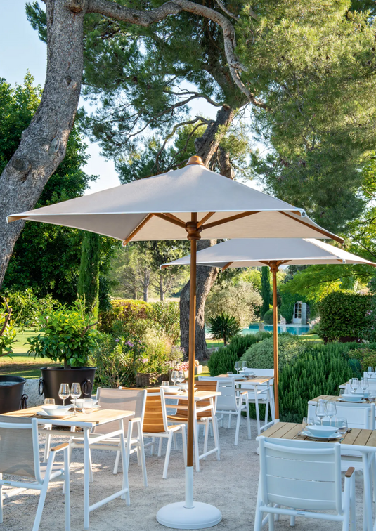 Fermob PILOTIS teak outdoor chair with aluminium frame, featuring sleek design and natural teak wood finish for outdoor seating.