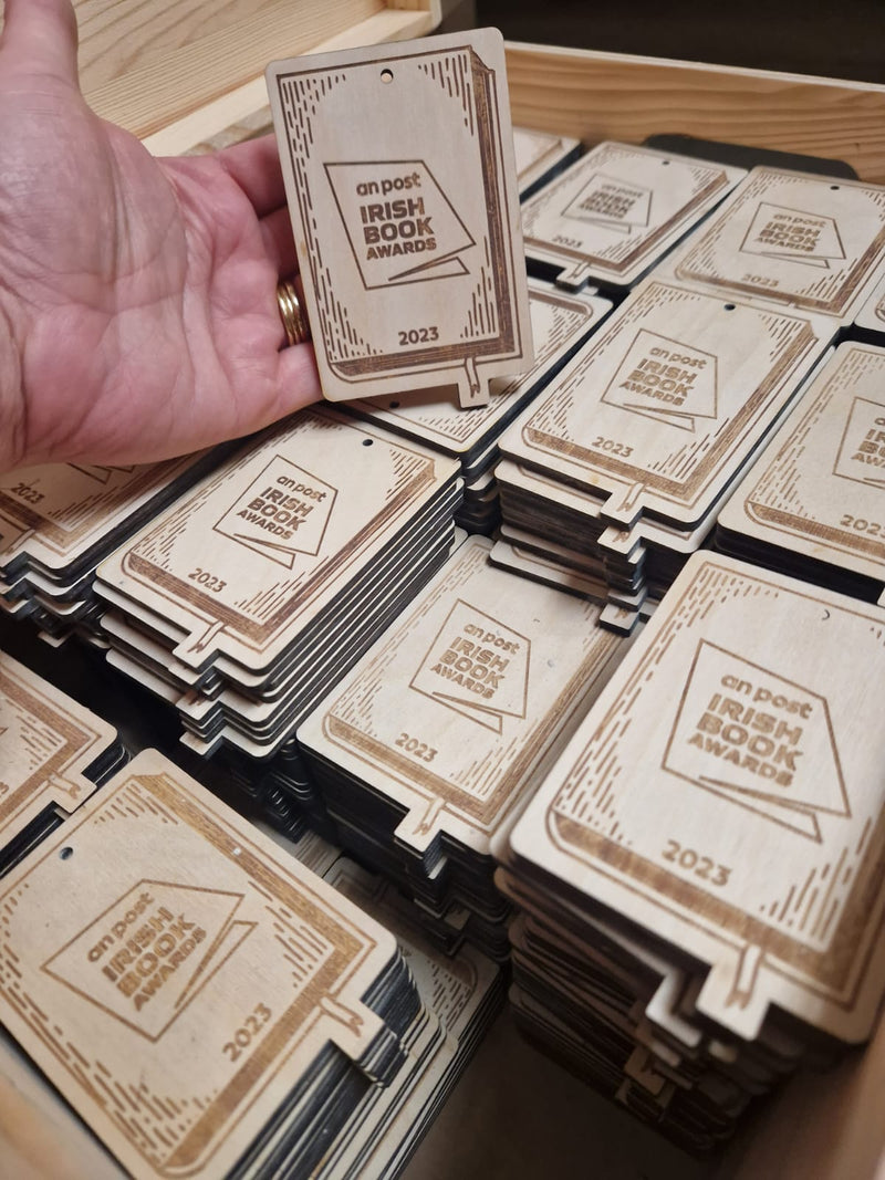 Load image into Gallery viewer, Custom Wood Designs awards with engraved plaques, showcasing handcrafted awards on a wooden display shelf.
