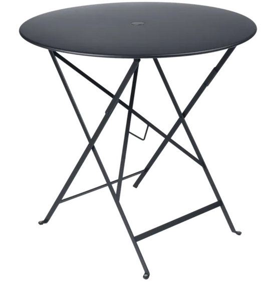 Fermob Ferob outdoor round bistro table, 77cm diameter, foldable metal table in anthracite with honey-colored surface.