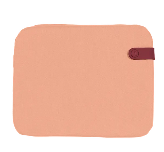 Fermob outdoor apricot Bistro cushion measuring 38x30cm on a chair seat pad for comfortable outdoor seating.