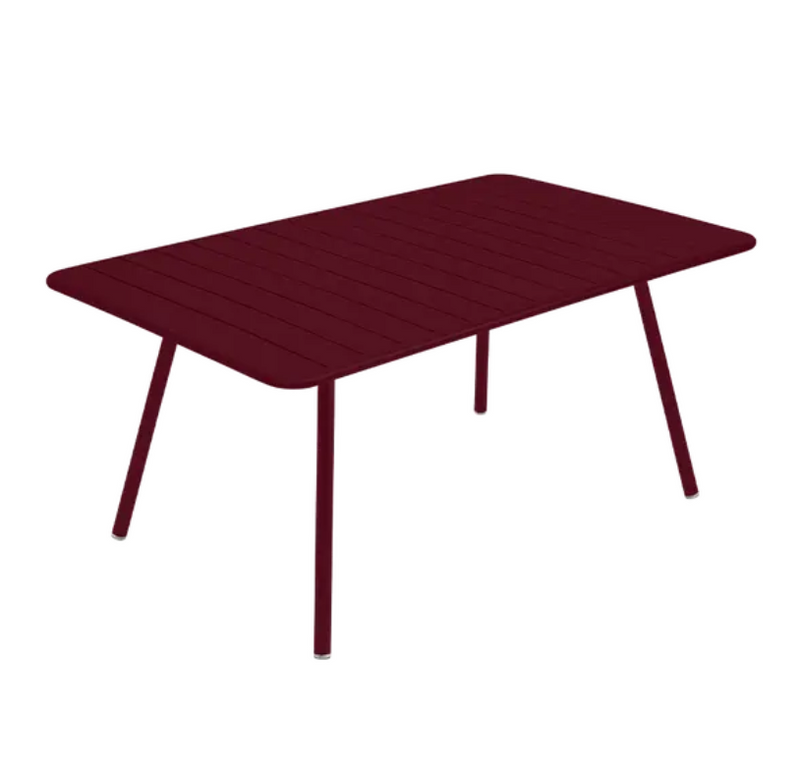 Load image into Gallery viewer, Black cherry Fermob Luxembourg metal outdoor table, 165 x 100 cm, with a sleek design for outdoor dining and entertaining.
