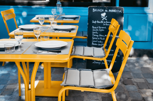 Fermob BASICS placemat measuring 45x35 cm with a modern design, perfect for table settings and outdoor dining.
