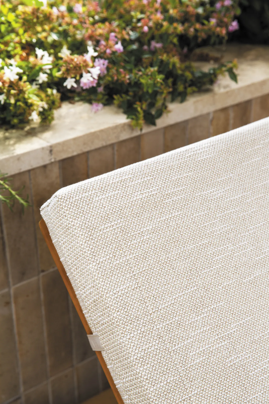 Fermob IBIZA teak outdoor sunlounger with a slatted teak frame, ideal for relaxing on the beach or patio.
