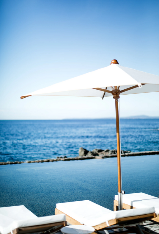 Fermob IBIZA teak sunlounger with a sleek outdoor design, featuring a sturdy teak frame perfect for relaxing on the beach or patio.