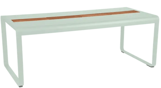 Ice mint Fermob Bellevie outdoor dining table with wood and metal design, 196 x 90 cm, eight-seater with built-in storage.