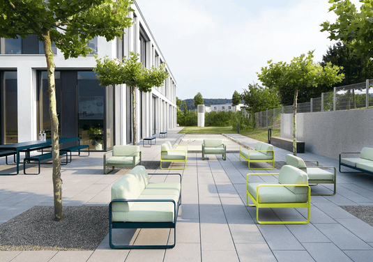 Bellevie 2-Seater Sofa - Custom Wood DesignsOutdoor Fermob Bellevie 2-seater sofa with colorful cushions, modern design, and wooden legs on a patio.Outdoor Sofa24575178949239