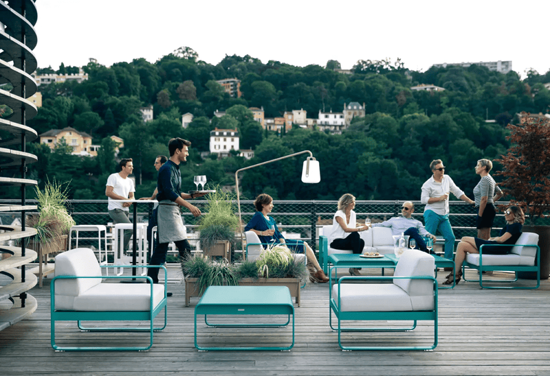 Load image into Gallery viewer, Fermob Bellevie 2-seater outdoor sofa with a sleek design and comfortable cushions, ideal for patio or garden lounging.
