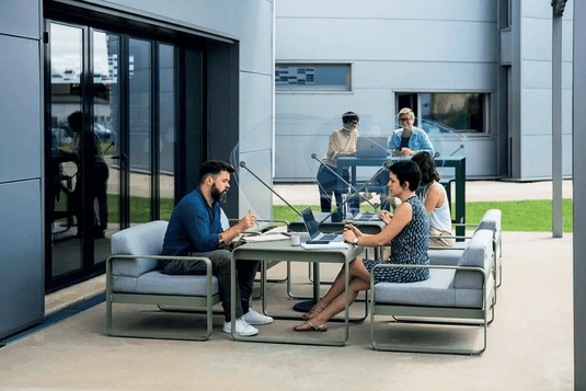 Fermob Bellevie armchair with a sleek metal frame and cushioned seat, ideal for modern indoor or outdoor lounge spaces.
