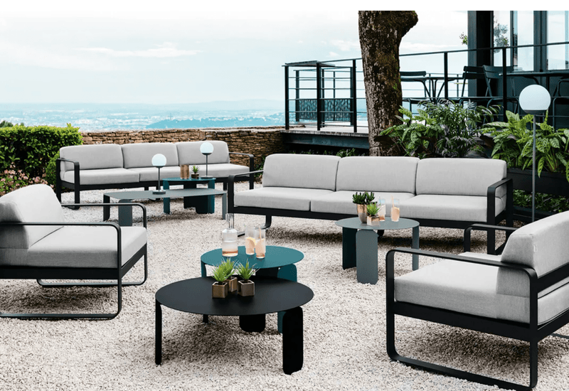 Load image into Gallery viewer, Fermob Bellevie armchair with metal frame and cushioned seat, showcasing a stylish and comfortable seating option for indoor or outdoor use.
