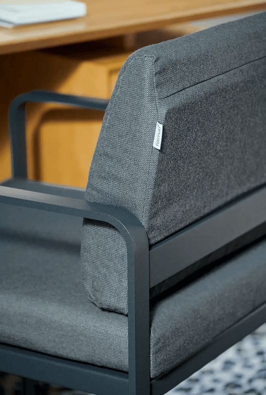 Fermob BELLEVIE outdoor dining armchair in Nutmeg Gray and Toupegu, featuring a stylish armrest design and cushioned seat.