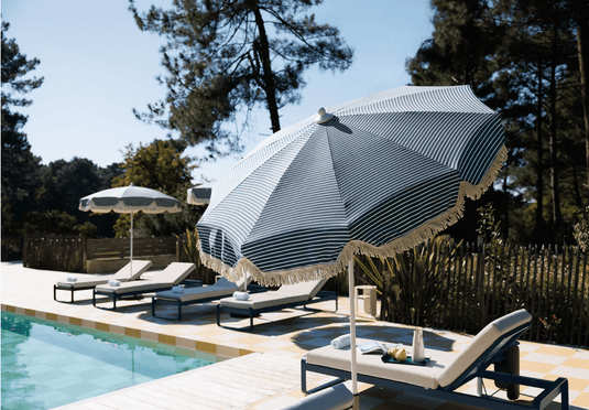 Fermob Bellevie Premium Sunlounger with adjustable backrest and sleek design for outdoor relaxation.
