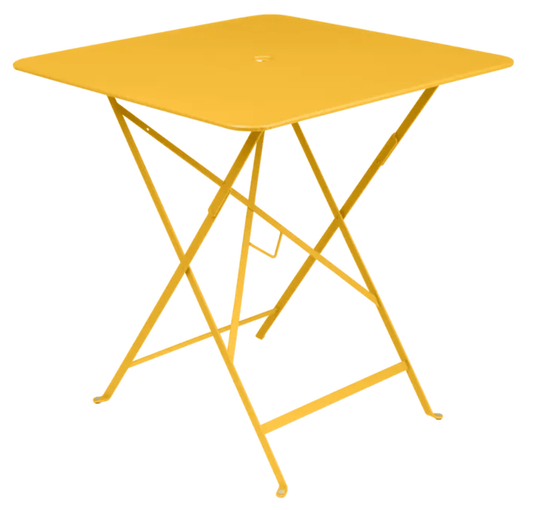 Bistro Table 71x71cm - Custom Wood DesignsHoney-colored foldable metal bistro table by Fermob, 71x71cm, suited for outdoor restaurant terrace seating.Foldable Table Ferob Outdoor7924.0Honey