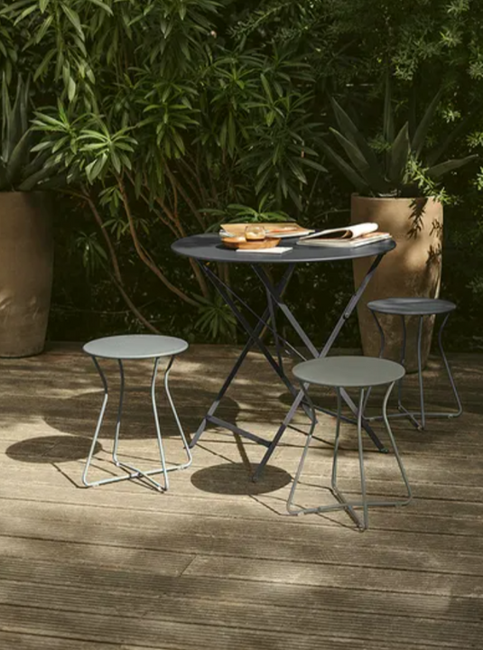 Fermob Bistro Table Ø77cm round folding outdoor table with a sleek, modern design, suitable for patio or balcony use.