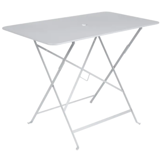 Fermob metal foldable bistro table, 97x57 cm, in honey color, suitable for outdoor cafe or patio use.