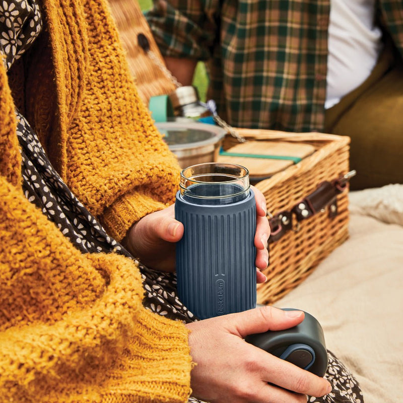 Load image into Gallery viewer, Black+Blum Glass Travel Cup 340ML - Custom Wood DesignsBlack + Blum glass travel cup 340ML for drinks, featuring a sleek black design and clear glass body for on-the-go beverages.DrinkwareP439.1602Glass,Siliconegrey
