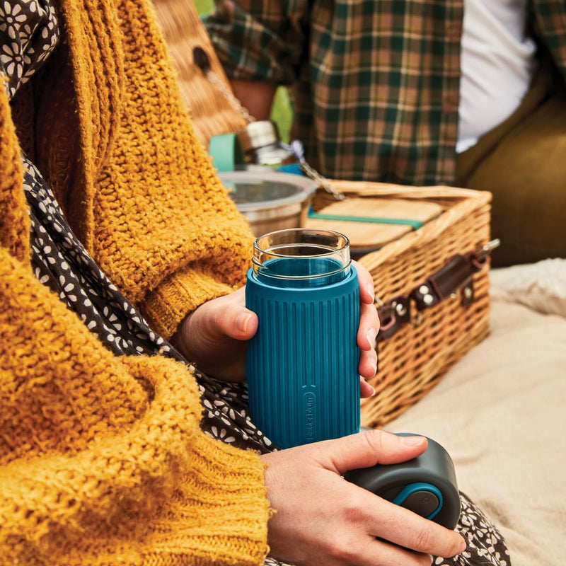 Load image into Gallery viewer, Black+Blum Glass Travel Cup 340ML - Custom Wood DesignsBlack + Blum glass travel cup with black lid, 340ML, showcasing sleek drinkware design for on-the-go beverages.DrinkwareP439.1633Glass,Siliconeturquoise
