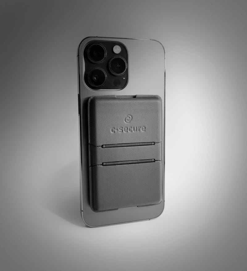 Load image into Gallery viewer, C-Secure Mag Safe phone wallet - Custom Wood DesignsC-Secure Mag Safe phone wallet attached to a smartphone, designed for secure card storage and easy magnetic attachment.Phone &amp; Tablet accessoriesP820.9901Polyurethaneblack
