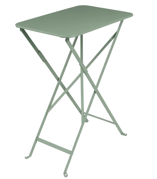 Cactus green Fermob Bistro folding rectangular metal table, 57x37 cm, ideal for hotel balcony or compact outdoor dining.