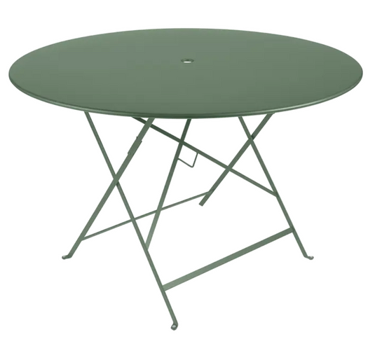 Fermob round outdoor bistro table with Ø117cm diameter, six-seater design, metal construction, ideal for outdoor dining spaces.