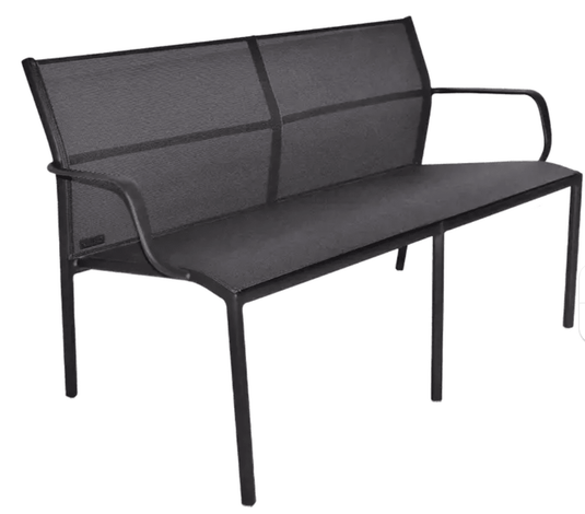Antracite Fermob Cadiz 2-Seater outdoor aluminum bench on patio with technical fabric cushions, ideal for garden seating.