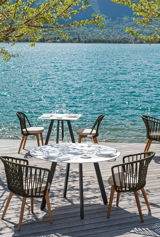 Fermob GORDES luxury teak outdoor chair with cushioned seating, perfect for patio or cafe outdoor spaces.