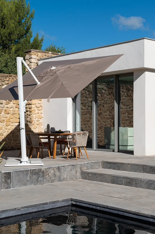 Fermob GORDES luxury teak outdoor chair with cushioned seating, ideal for cafe or patio outdoor spaces.