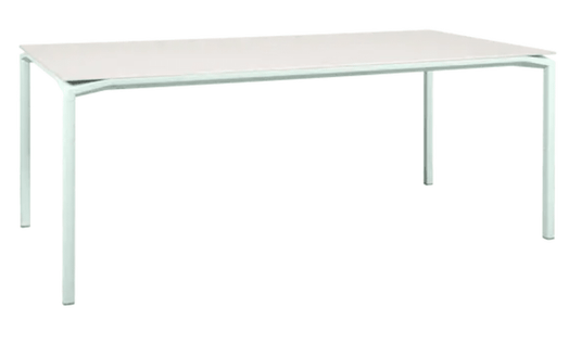 Fermob Calvi Aeris mineral dining table in Ice Mint color, 195 x 95 cm, eight-seater table with sleek surface and sturdy legs.