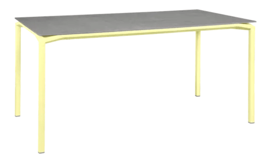 Fermob CALVI Creta mineral dining table in grey with lemon accents, 160 x 80 cm, six-seater outdoor table with modern design.