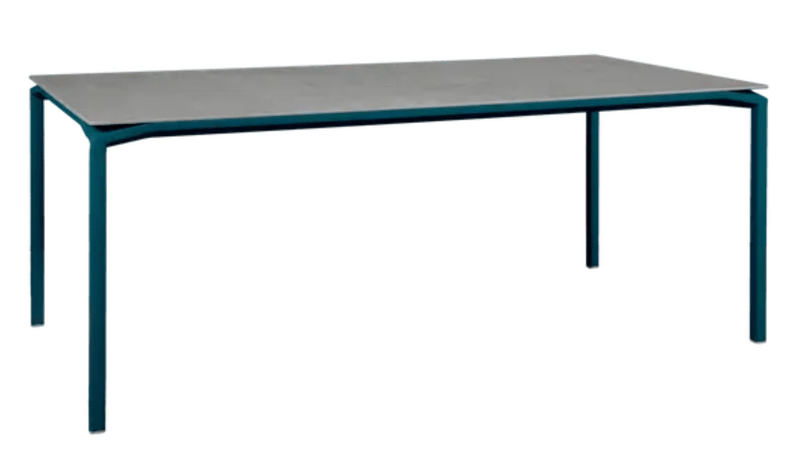 Load image into Gallery viewer, Fermob CALVI Kreta mineral dining table with eight seats, featuring a sturdy tabletop and modern design in natural stone finish.
