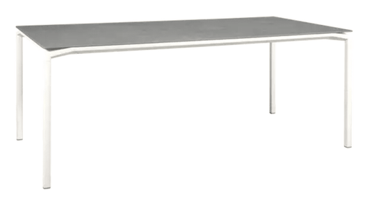 White Fermob CALVI Kreta mineral dining table, 195 x 95 cm, eight seater with sleek tabletop and sturdy legs.