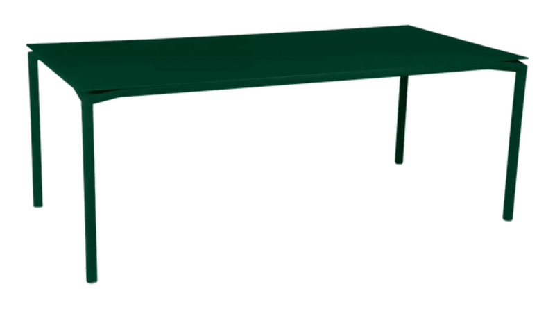 Load image into Gallery viewer, Fermob Calvi outdoor rectangular dining table in cedar green, 195 x 95 cm, suitable for outdoor and indoor use.
