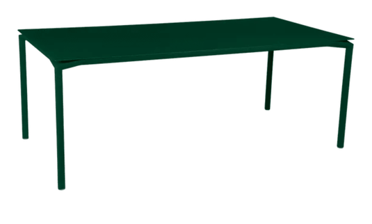 Fermob Calvi outdoor rectangular dining table in cedar green, 195 x 95 cm, suitable for outdoor and indoor use.
